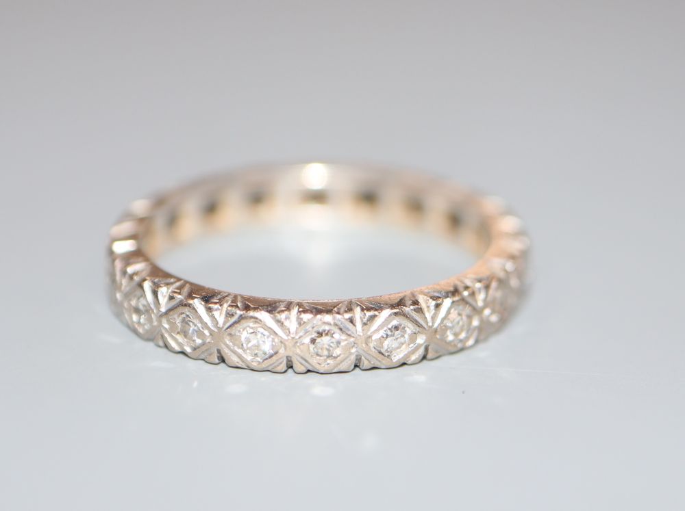 A modern 18ct white gold and diamond set full eternity ring, size M, gross 3.5 grams.